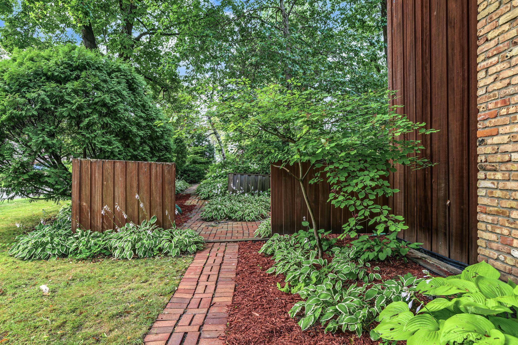 Yard features a partial privacy fence and also an invisible fence for your pet.