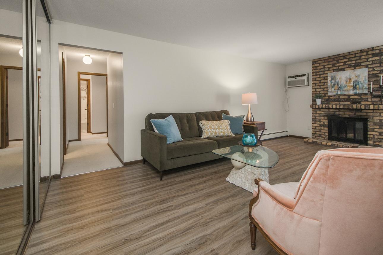 View from front entry. Newer vinyl plank flooring in living/kitchen/dining!