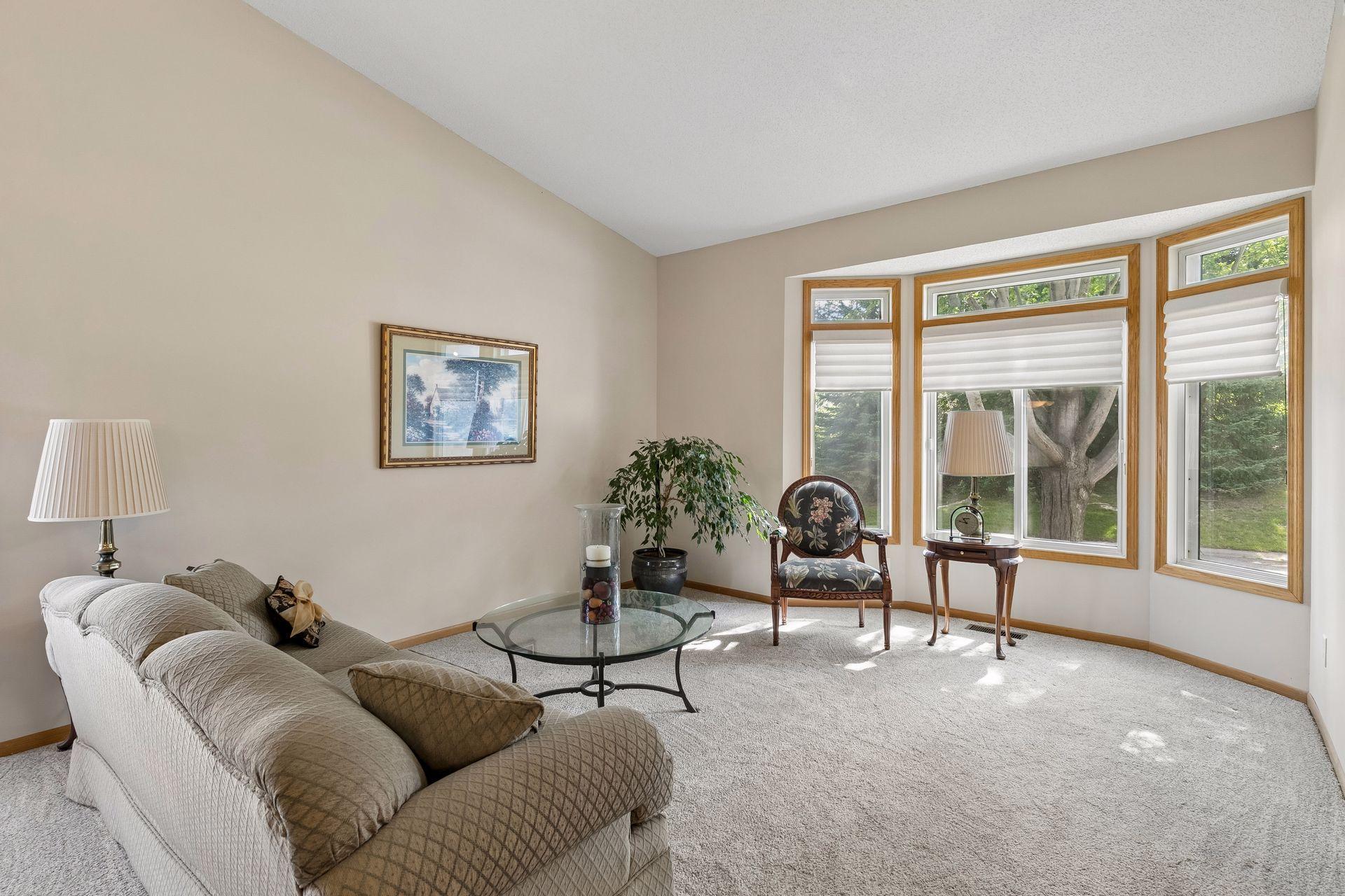 Main level living room with vaulted ceilings and new carpet