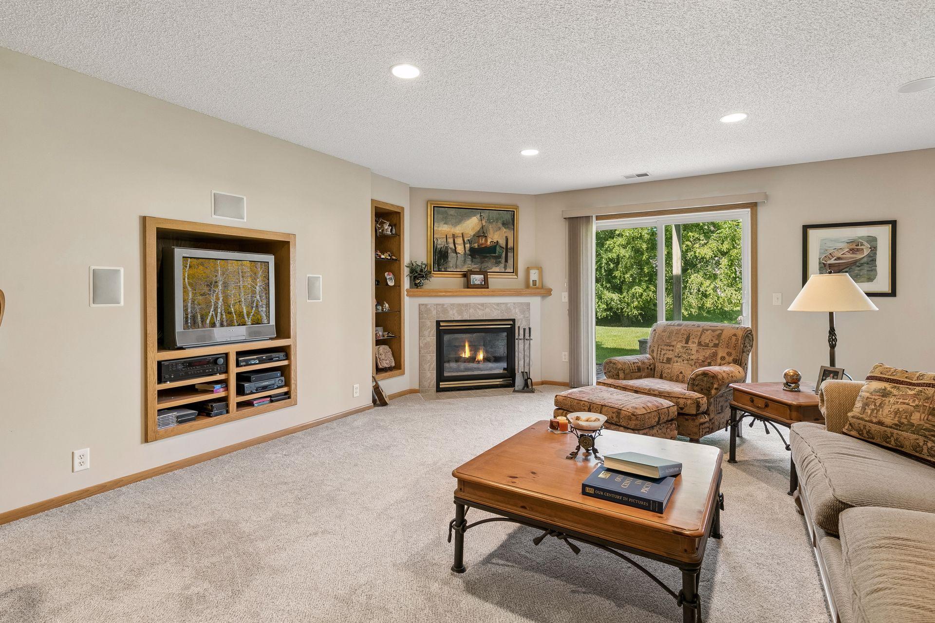 Walk-out lower level family room with gas FRPL and wet bar.