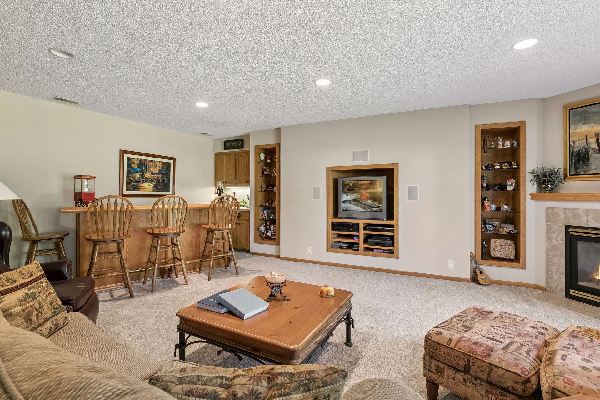 Walk-out family room with wet bar and corner fireplace.
