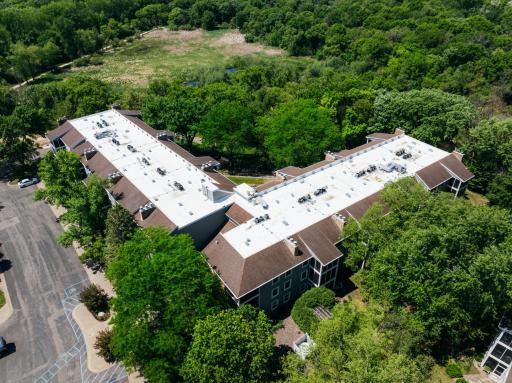 New Flat Roof: Aerial View of SAM 2 Rooftop after install of TPO White Flat Roof DJI_20260527224324_0035_D-14.jpg***.jpg