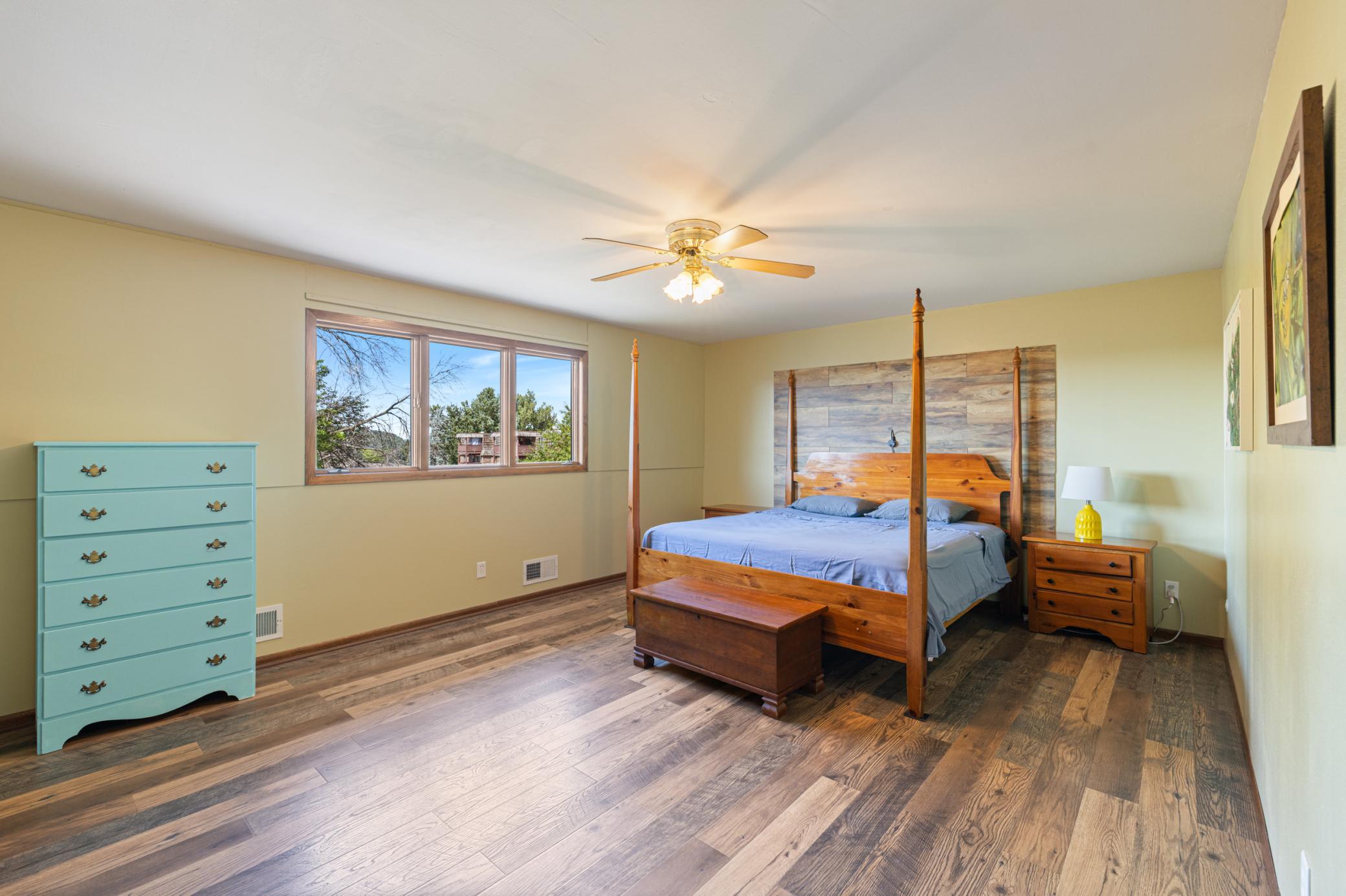 Spacious Primary Bedroom with Ceiling Fan