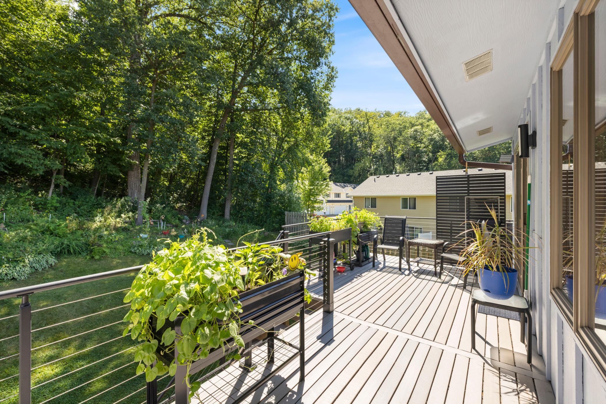 Spacious deck overlooking mature trees