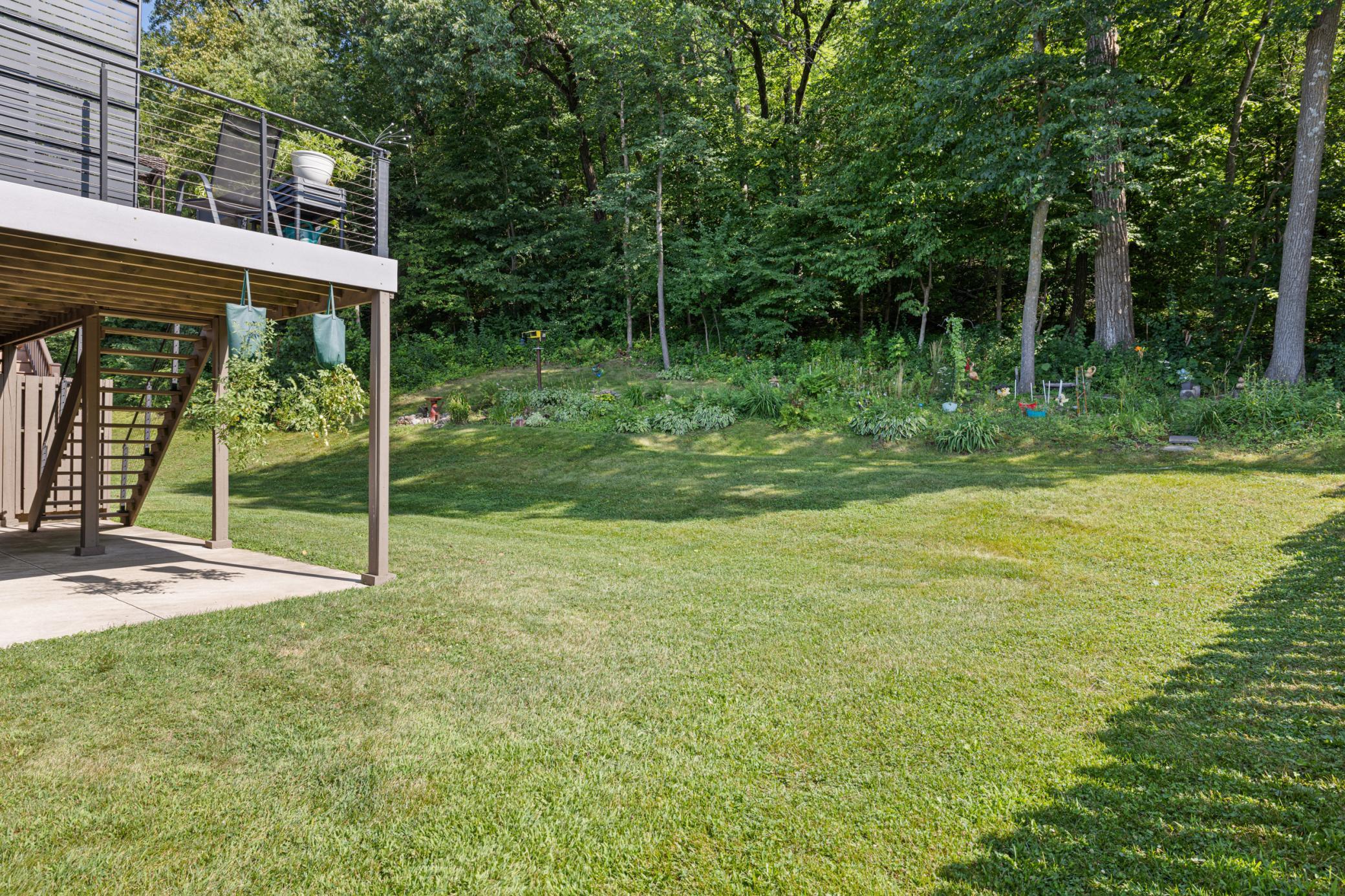 Private backyard setting overlooking natural birm