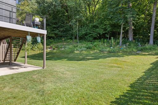 Private backyard setting overlooking natural birm
