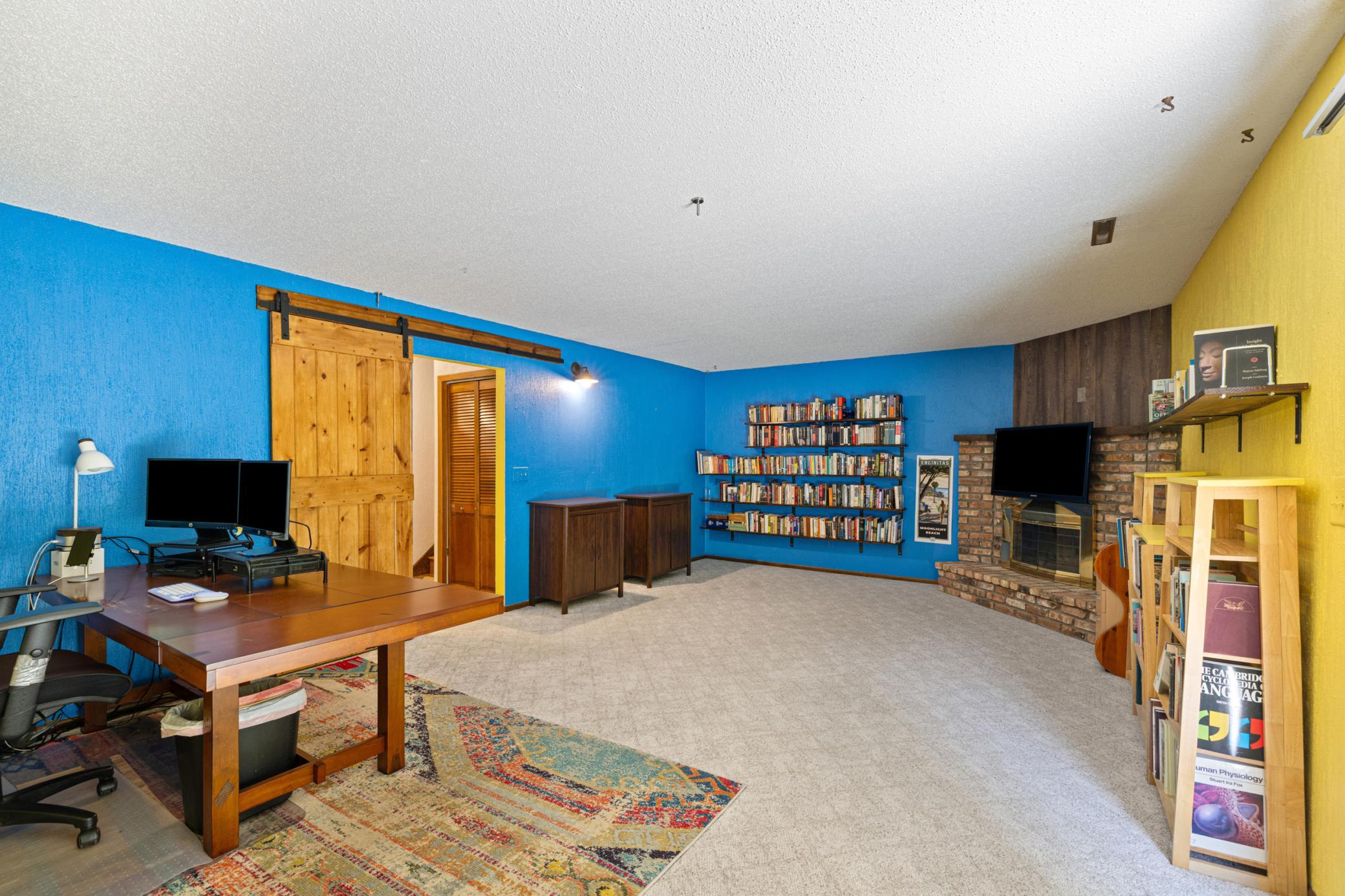 Lower level family room features a fireplace for chilly nights!