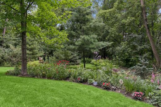 A variety of trees and perennial gardens throughout the property.