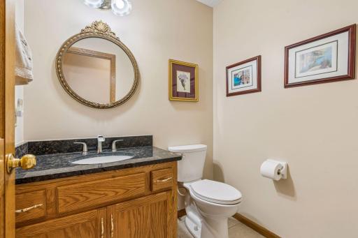 Main level half bath conveniently located in the "mud room" area. If you are playing outside you don't need to access the main house to use the washroom.