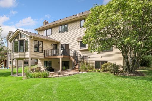 Composite deck conveniently located off the four season porch and informal dining area