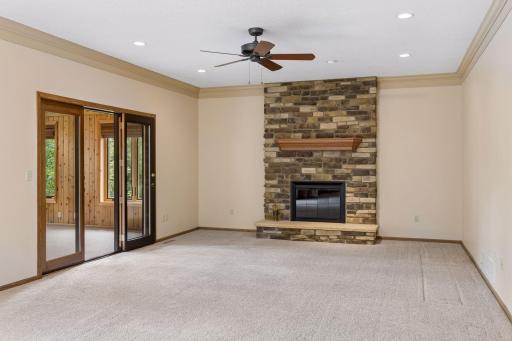 Cozy wood burning fireplace with beautiful stone surround