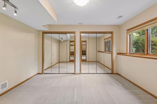 Fifth bedroom has large closet with built in closet system