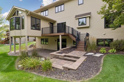 Maintenance free composite steps lead to stone paver landing