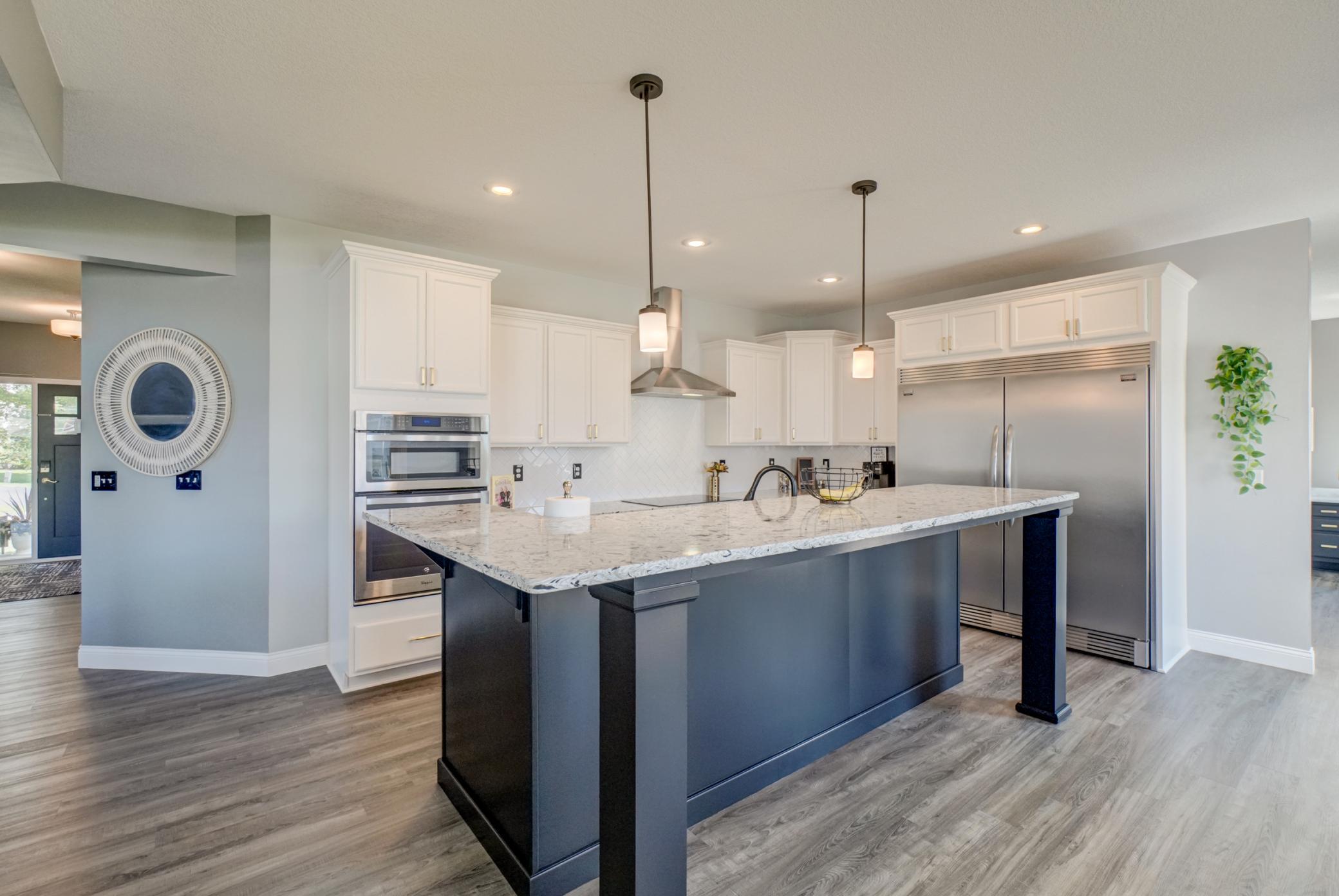 Welcome to 5204 Porchlight Bay! This gourmet kitchen is the heart of the home, featuring premium stainless steel appliances and granite countertops!