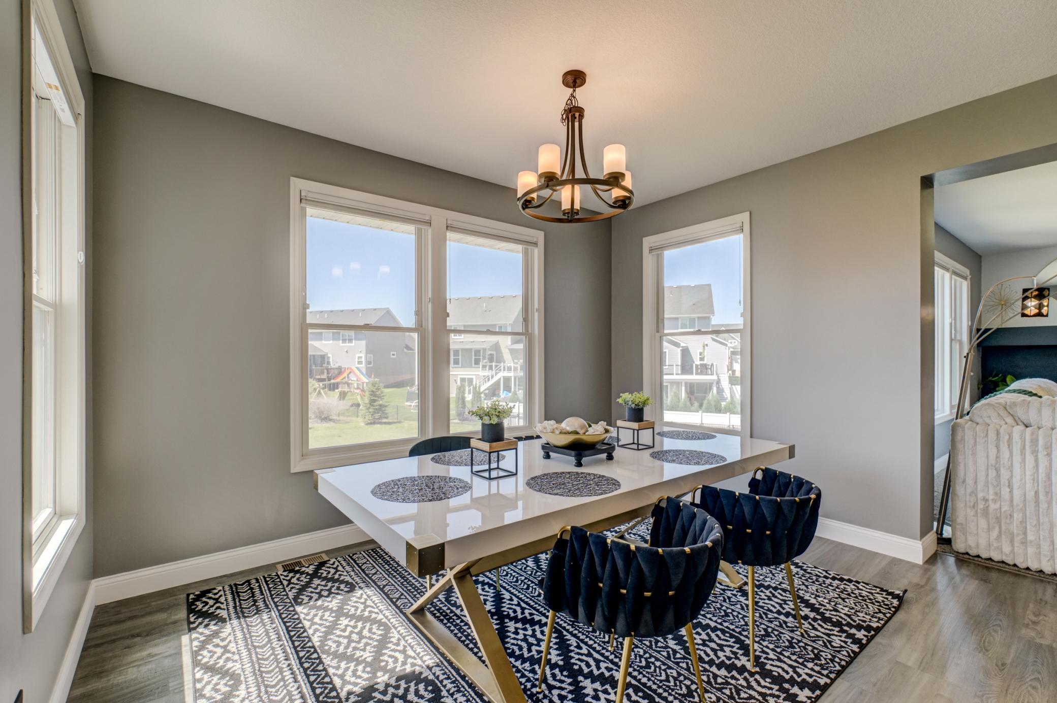 The adjoining dining area offers the perfect setting for everyday meals or hosting special occasions