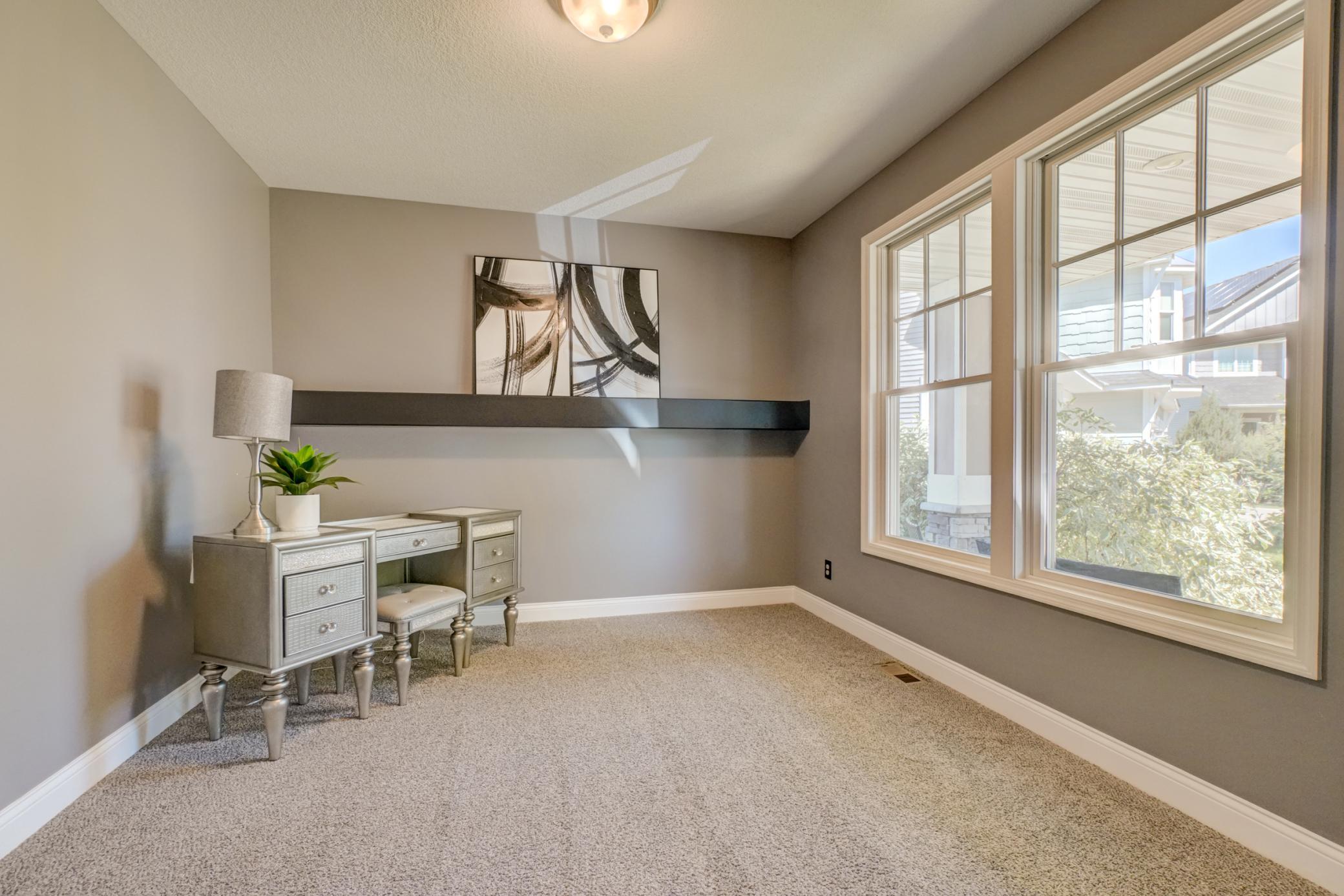 The versatile room is ideal for a home office, playroom, reading nook, or additional living space!