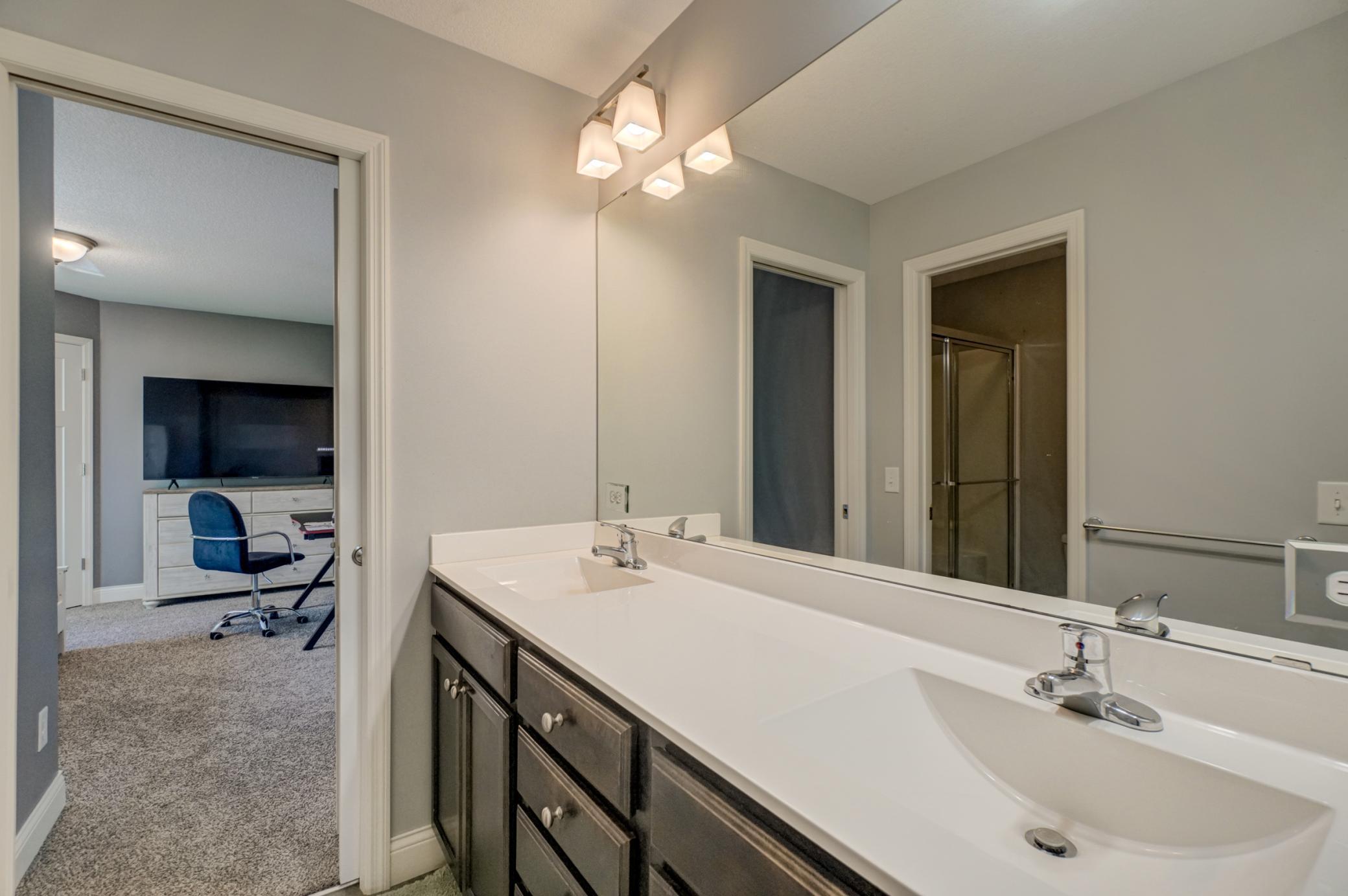 Enjoy the convenience of double sinks and ample cabinet space for storage