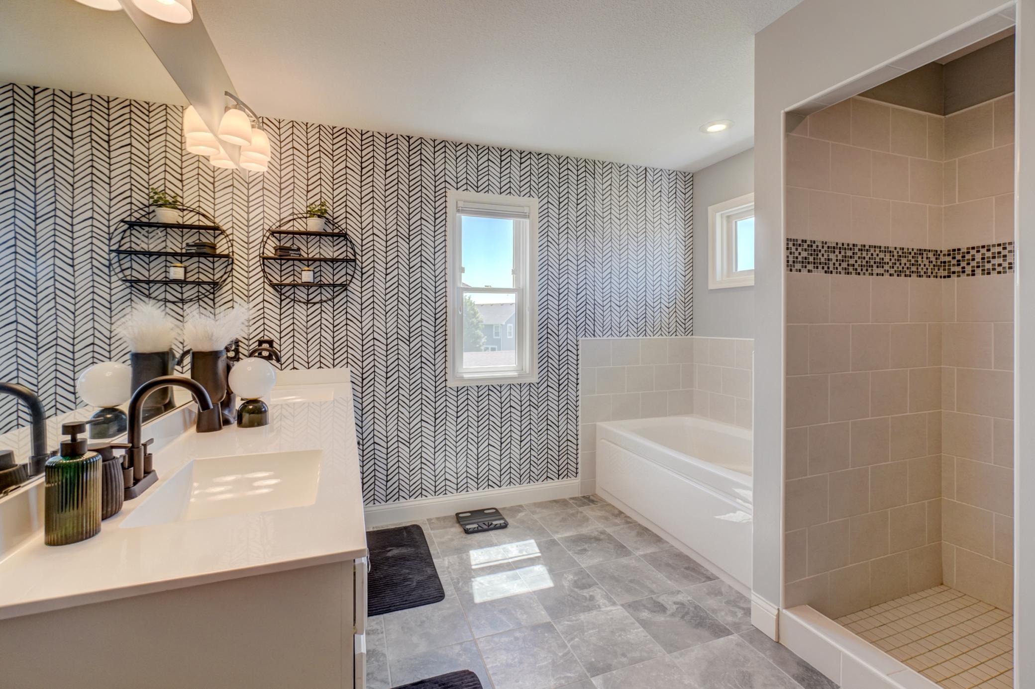 The spa-inspired primary bath offers a peaceful escape with beautiful finishes and thoughtful design