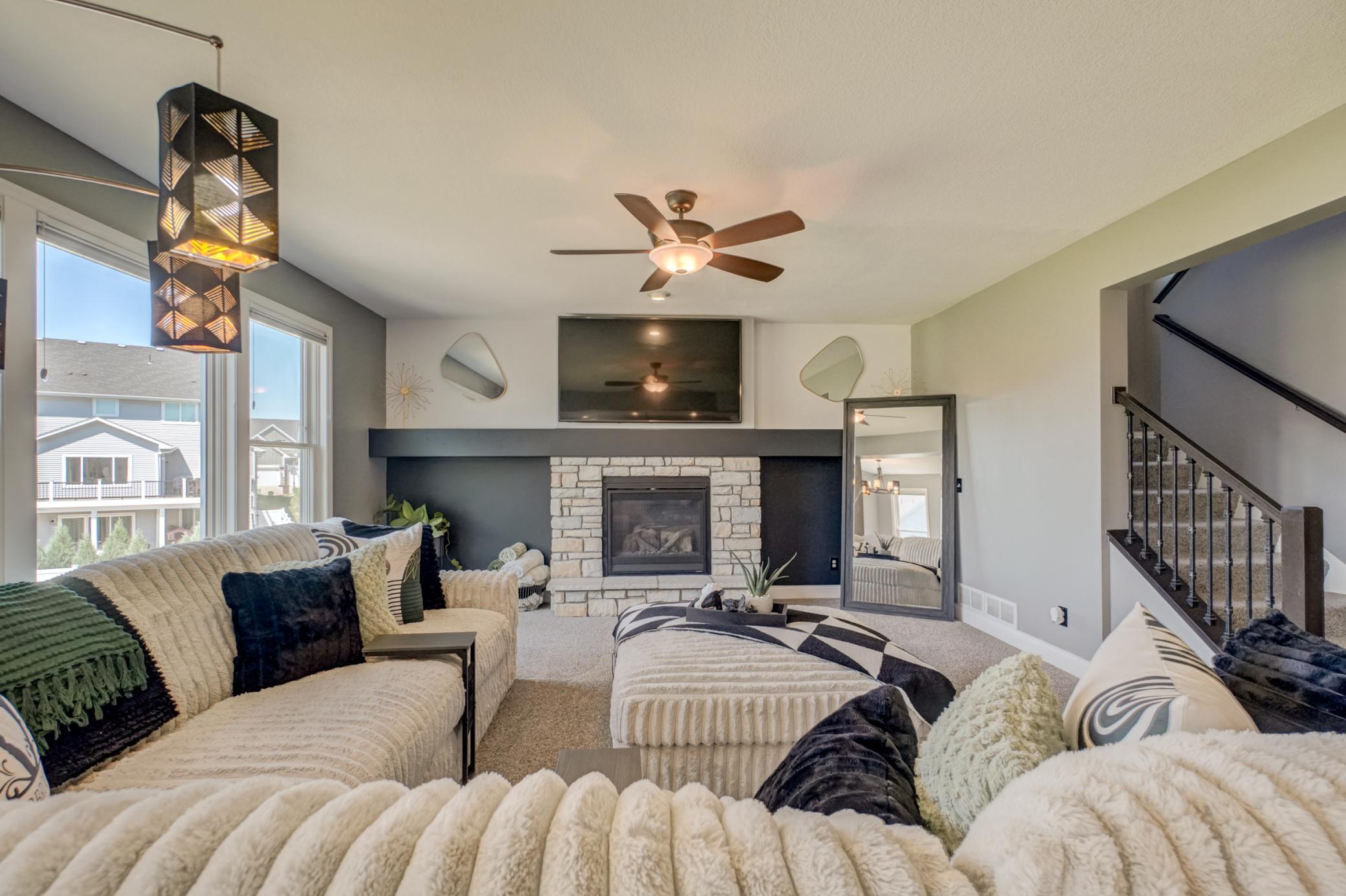 The open-concept great room is filled with natural light, creating an inviting space for everyday living and entertaining!