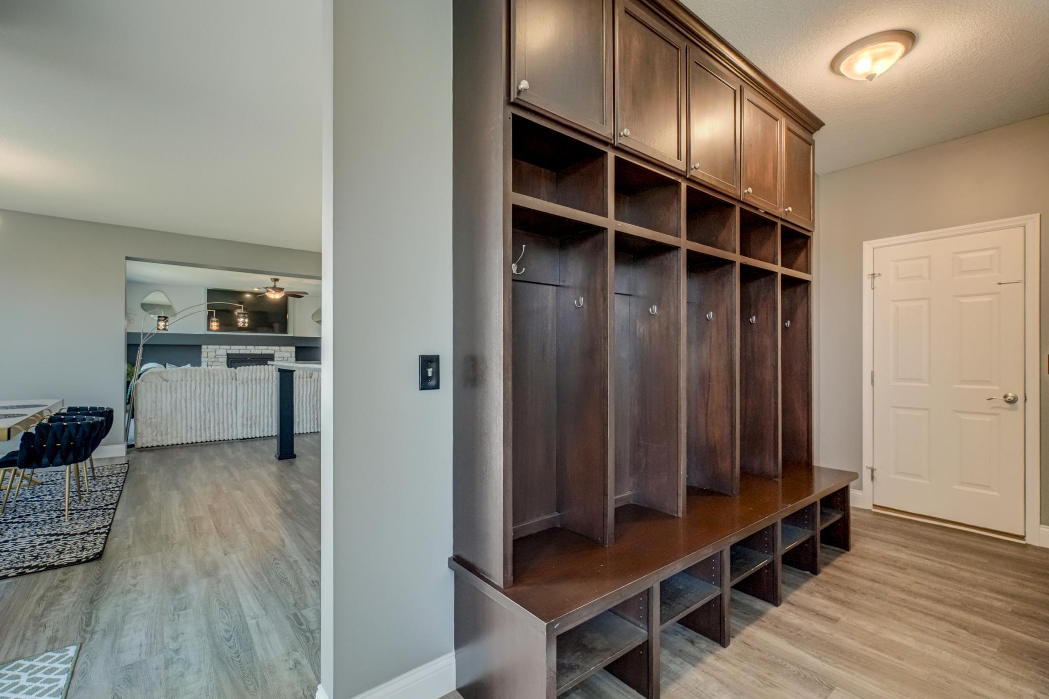 Functional mudroom seamlessly connects to a hidden pantry and built-in command center for effortless everyday living!