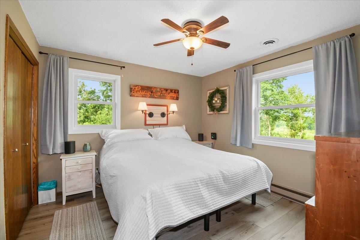 Another spacious bedroom with natural light