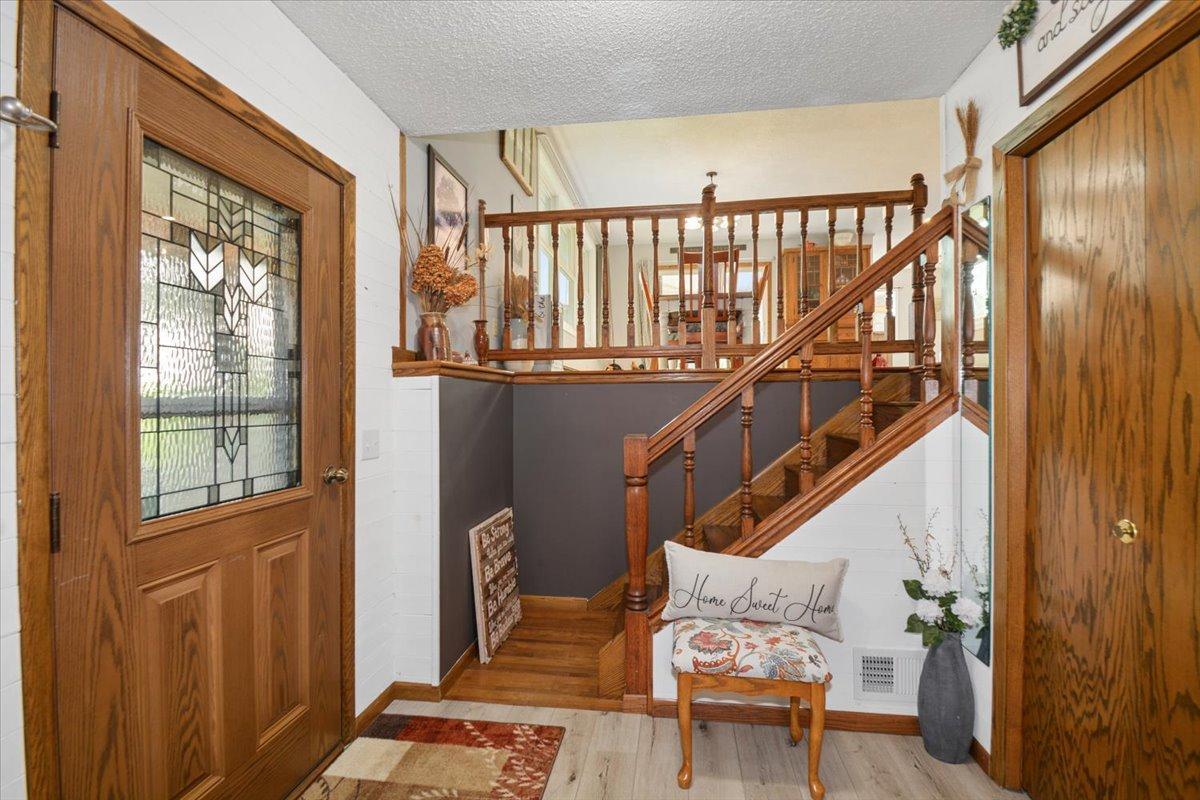 Inviting foyer with a beautiful front door