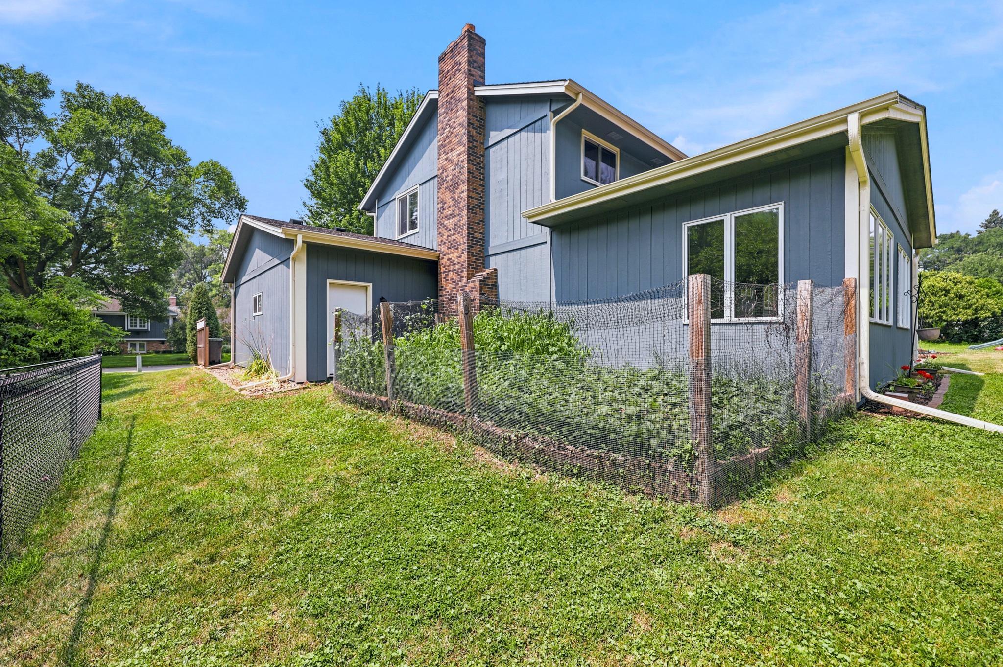 Side yard has a large garden
