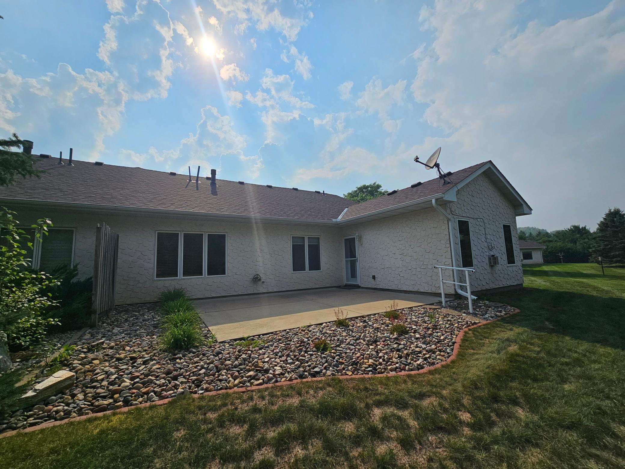 Additional view of back of the home and patio area.