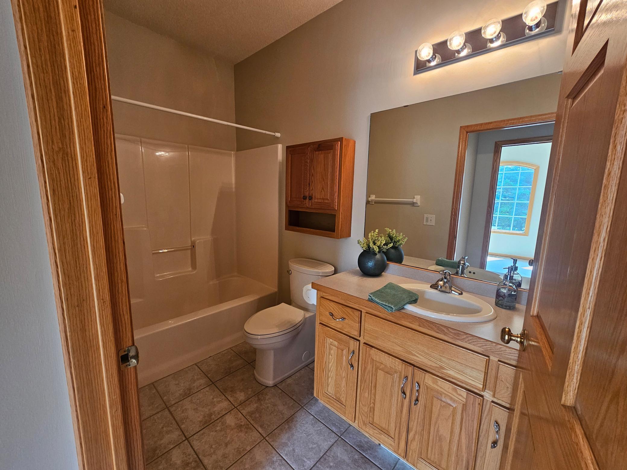 Full bathroom near front bedroom.