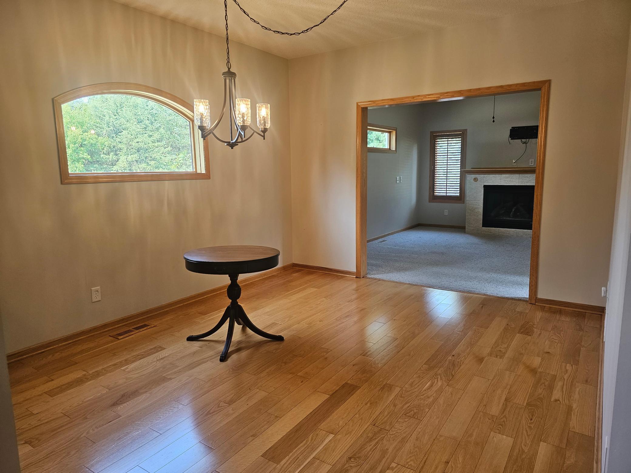 Dining area features hardwood floors.
