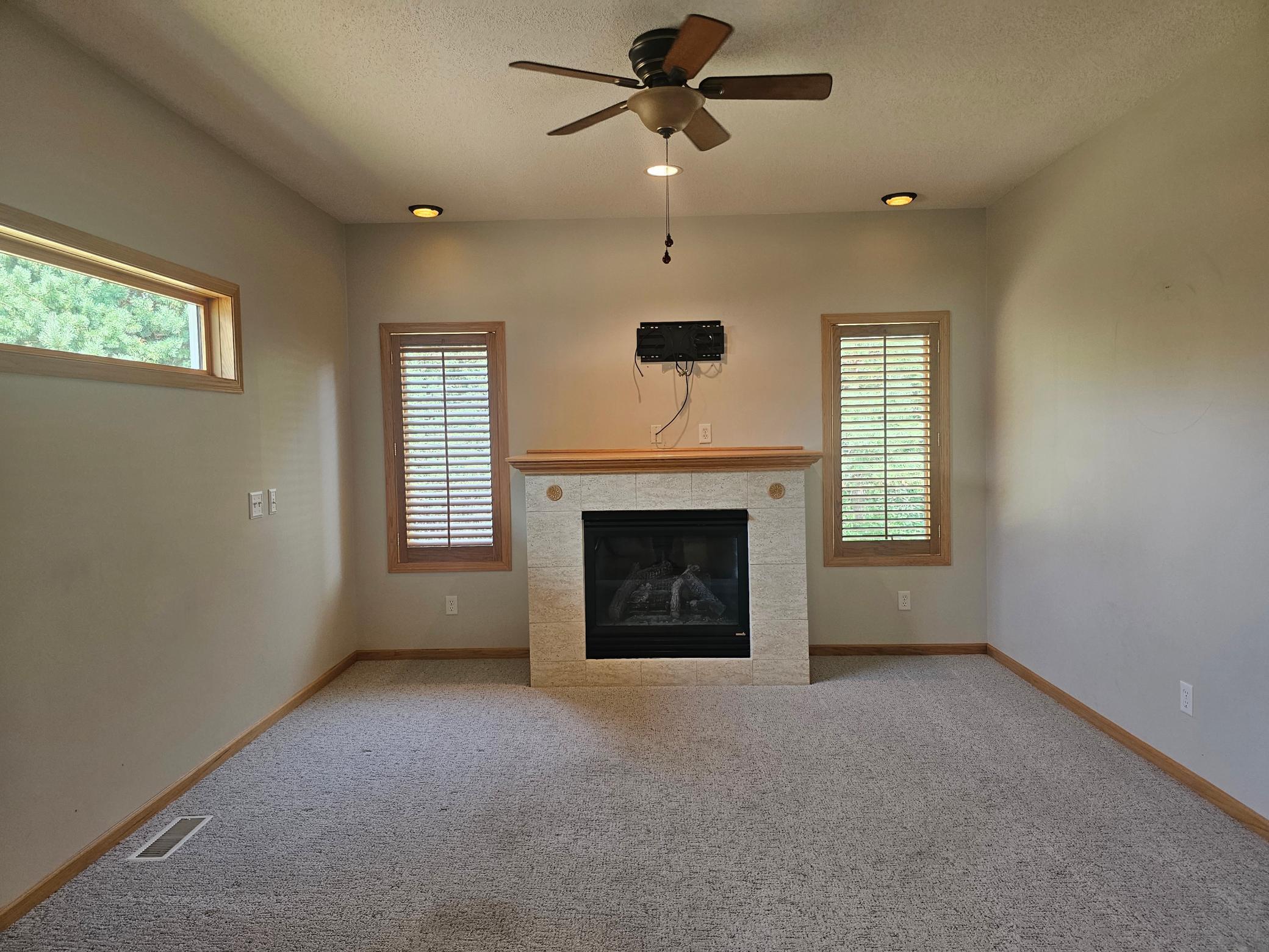 Family room features another gas fireplace and features door to the backyard patio.