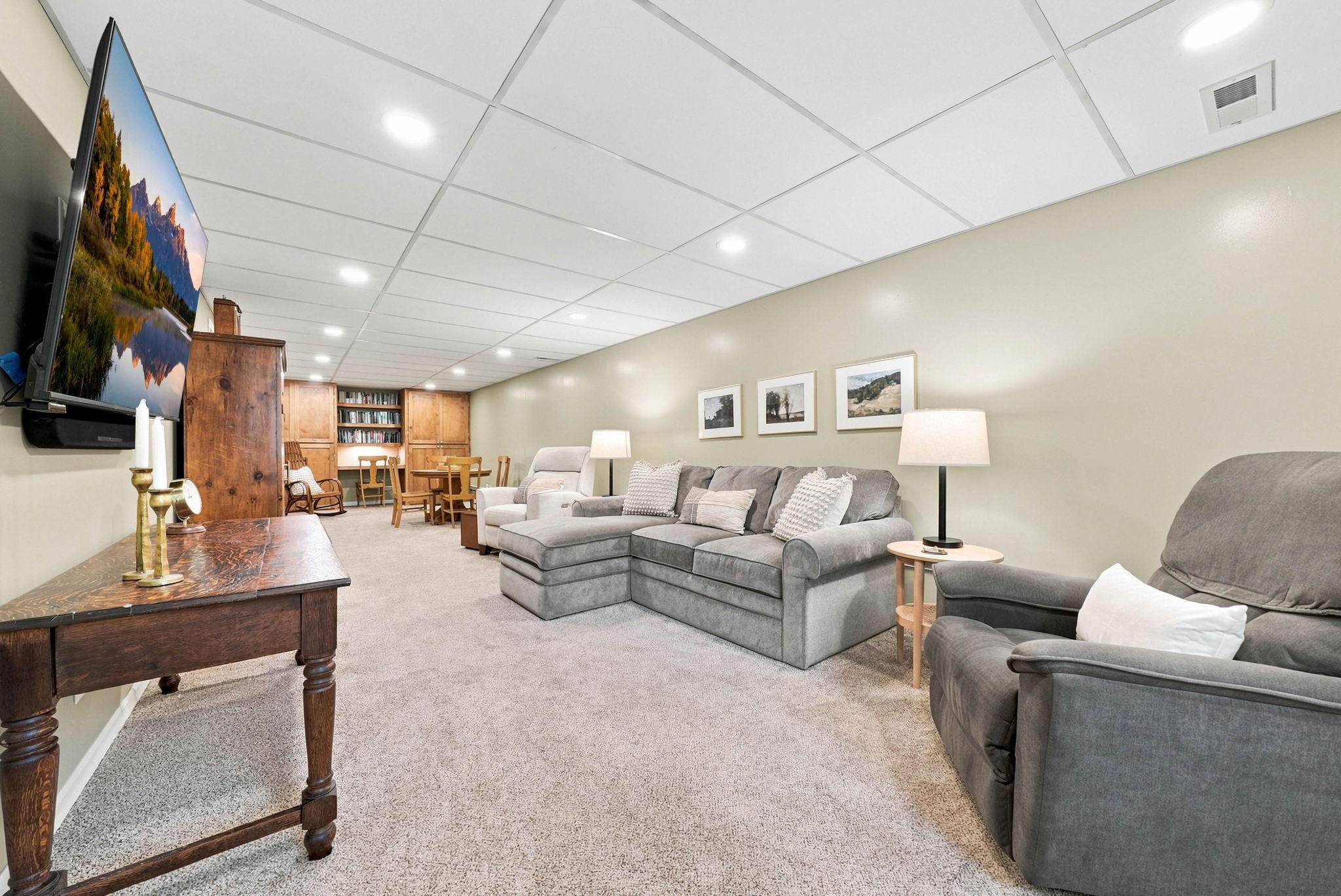 Head to the fully finished lower level with brand new carpeting throughout