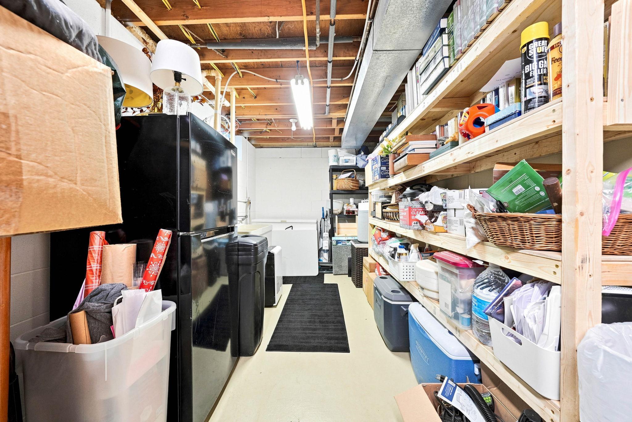 Spacious and functional unfinished storage area with built-in shelving