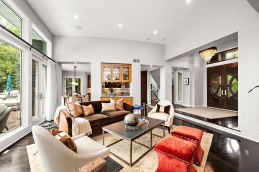 A welcoming entry opens effortlessly into the heart of the home, where soaring ceilings and an open concept layout create a natural flow between the living, dining, and kitchen spaces - designed for both comfortable everyday living & entertaining.