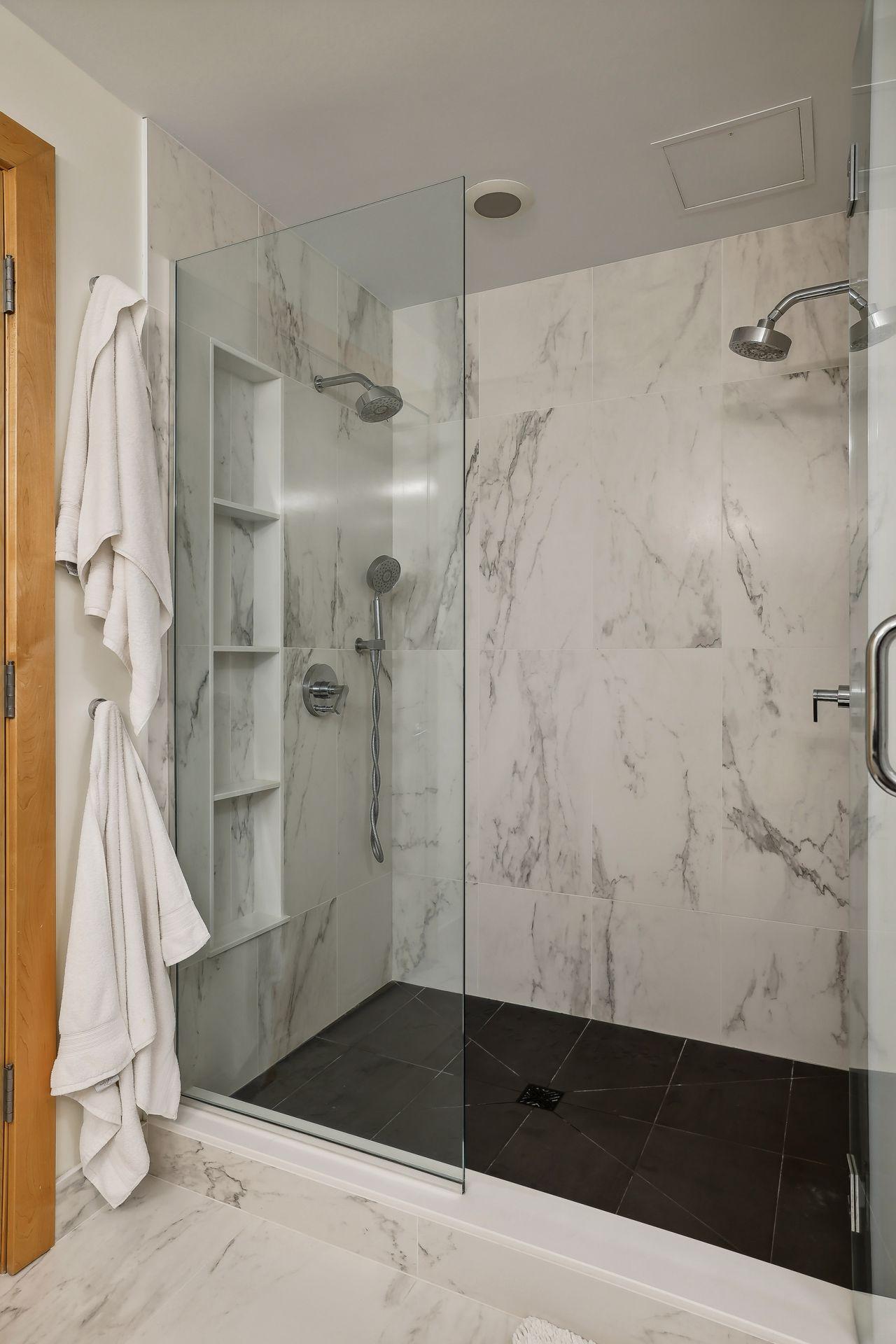 4 shelf shower alcove. double headed showers with shower wand.