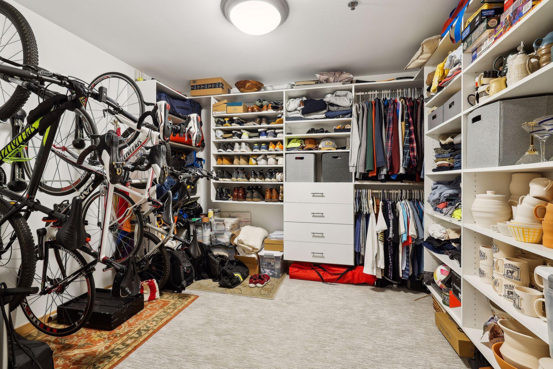 nearly 12x12 closet with 2 walls of closet organizers