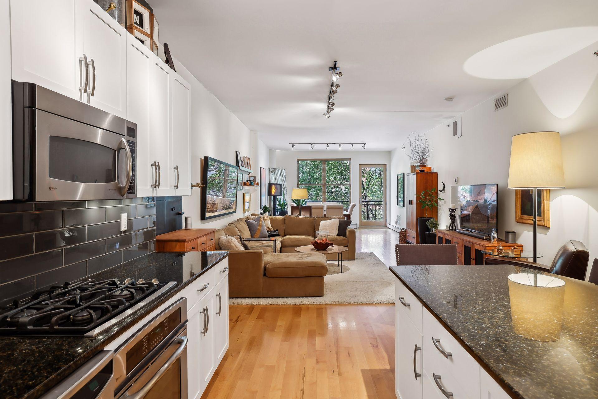 big open floor plan with real hardwood floors