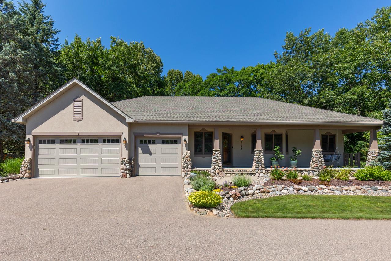 Nestled at the end of a quiet cul-de-sac on a spectacular 0.46-acre wooded homesite, this exceptional custom Lecy Construction Craftsman—featured in the 1996 Parade of Homes—offers an unmatched blend of luxury, privacy, and timeless design.