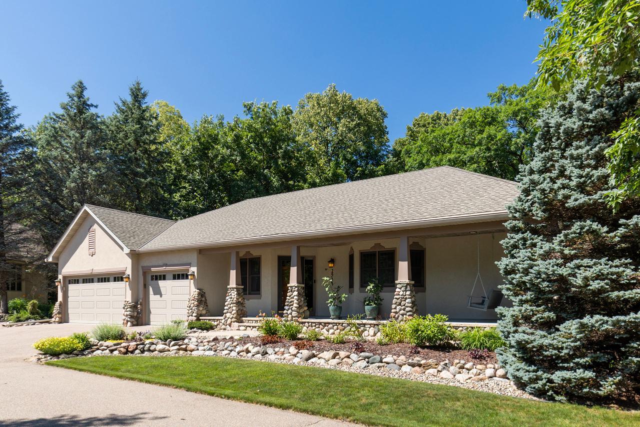 Nestled at the end of a quiet cul-de-sac on a spectacular 0.46-acre wooded homesite, this exceptional custom Lecy Construction Craftsman—featured in the 1996 Parade of Homes—offers an unmatched blend of luxury, privacy, and timeless design.