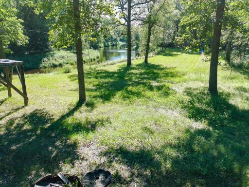 Front yard view. Willow river in the background.