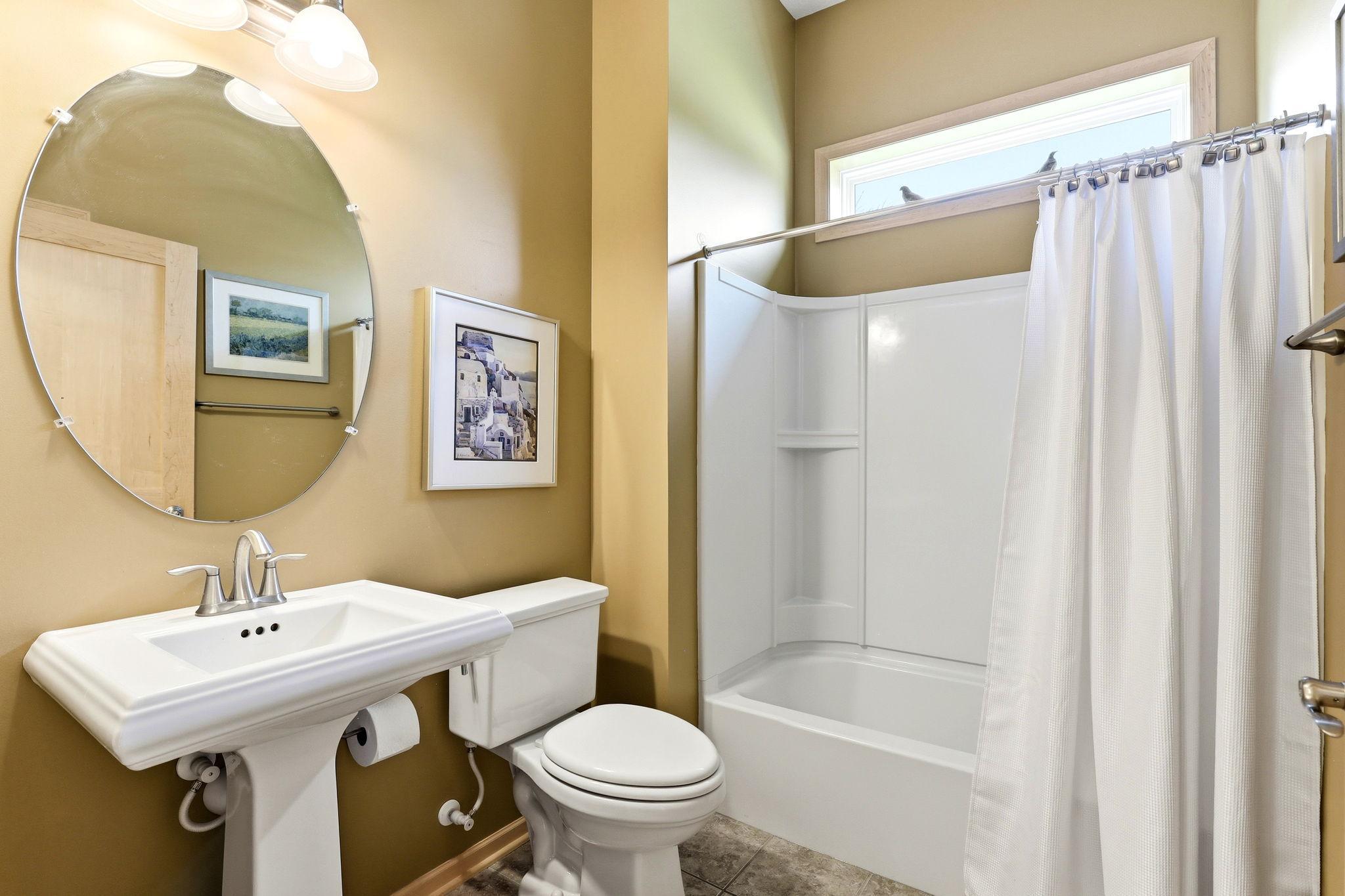 Full bath offers a clean, bright space with a functional layout and modern finishes.