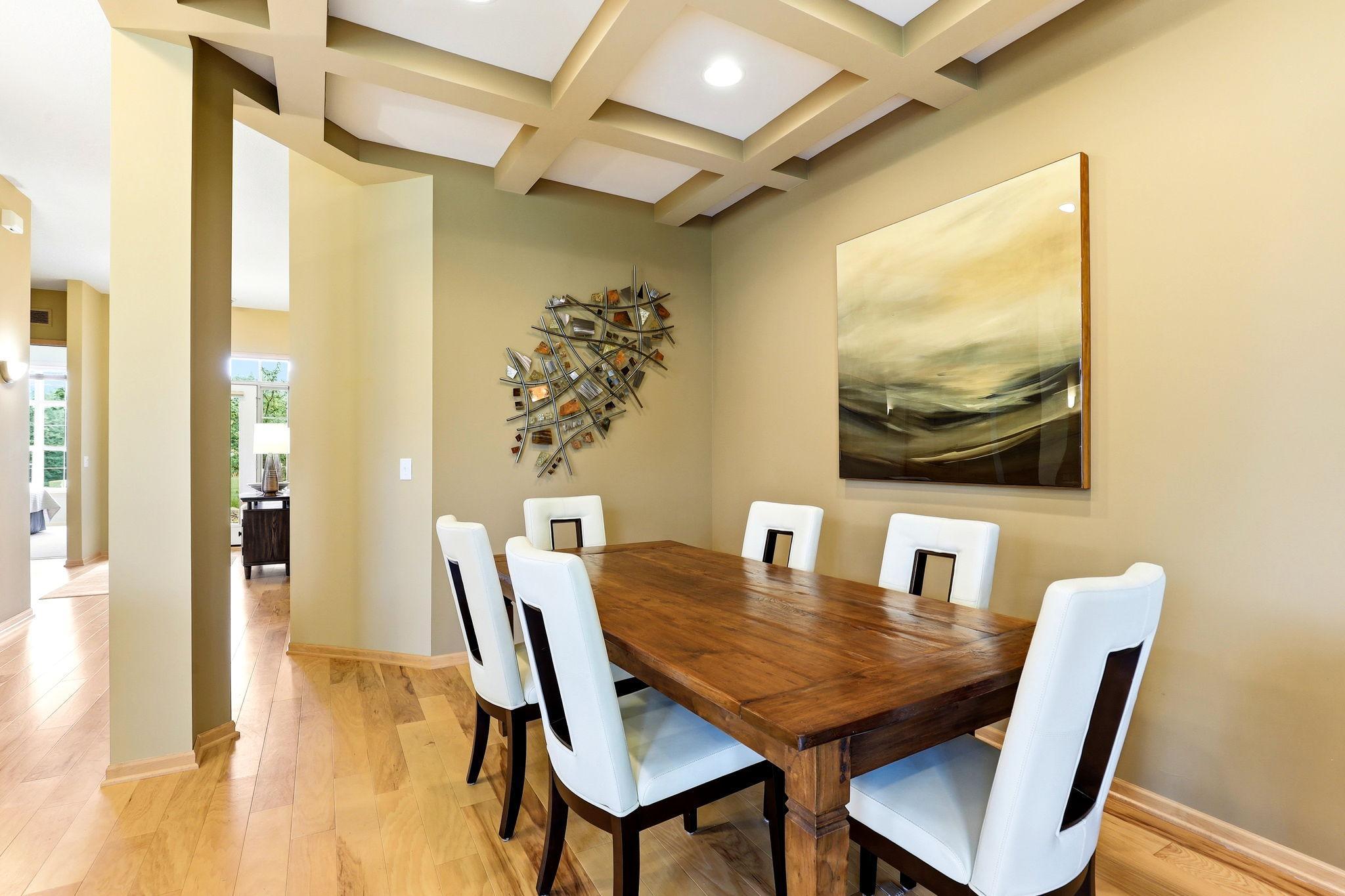 Dedicated dining space highlighted by a striking ceiling for an elevated, custom look.