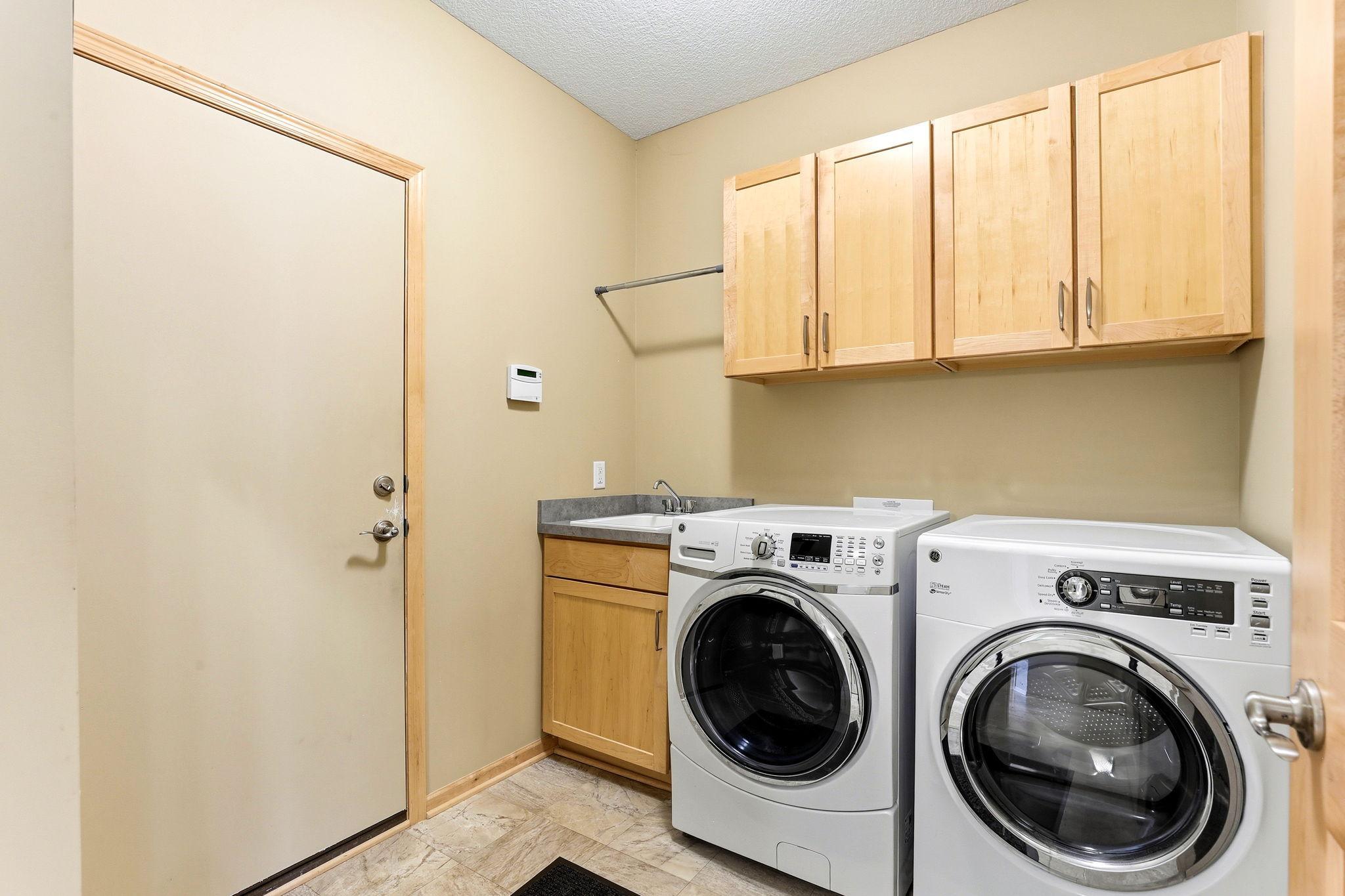 Dedicated laundry room offers a clean, organized space for daily chores. Bright, functional, and designed for easy workflow with plenty of room to move.