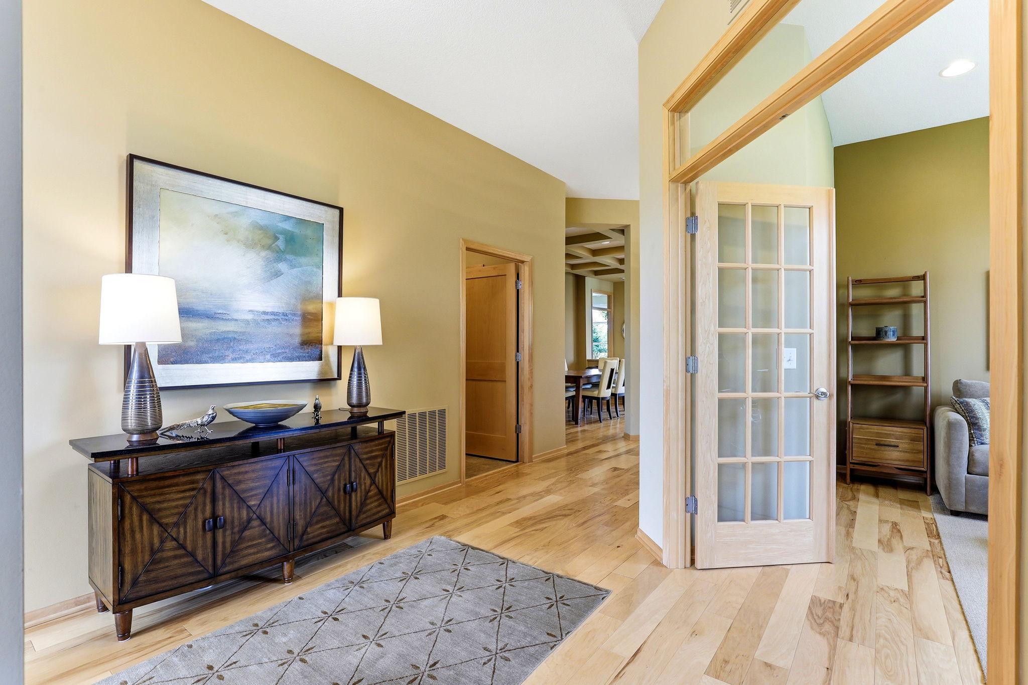 Front office framed with classic French doors, creating a polished and private workspace. Bright, inviting, and perfectly positioned near the main entry.