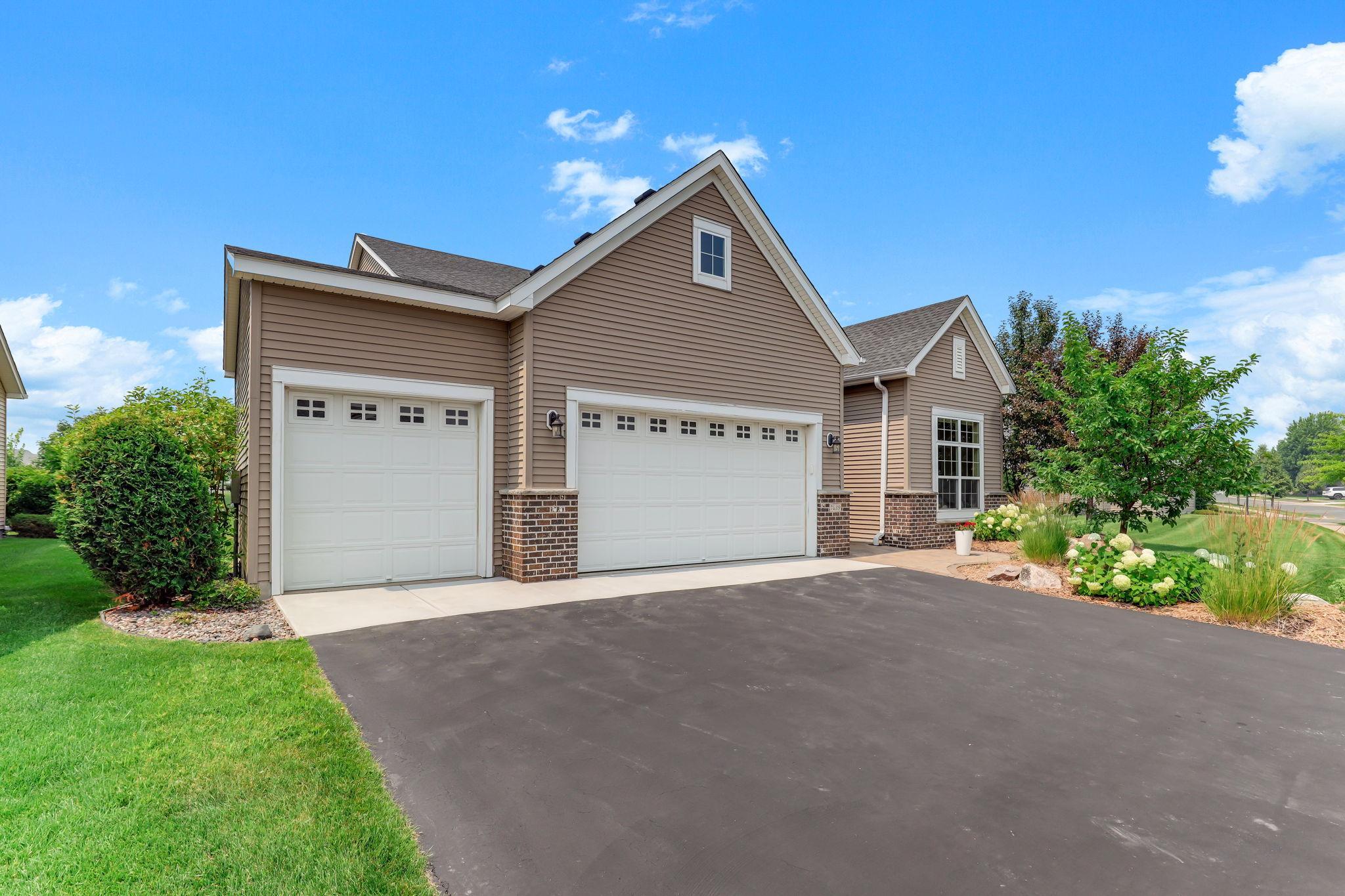 Three-stall garage showcasing abundant storage, hobby space, and room for all your vehicles. Clean, spacious, and well-lit for easy everyday use.