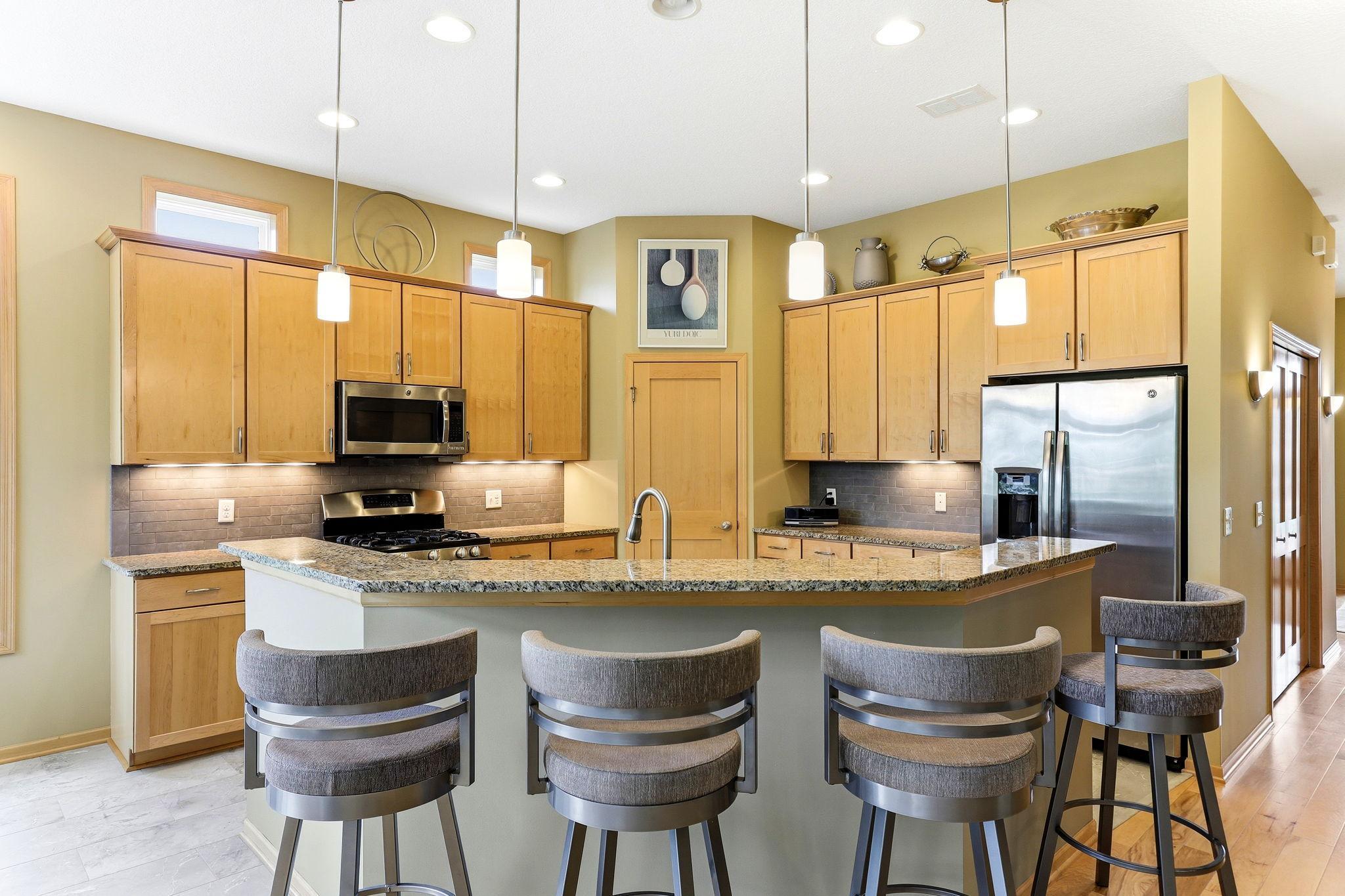 Kitchen with a spacious island featuring bar-height seating for casual dining and easy entertaining.