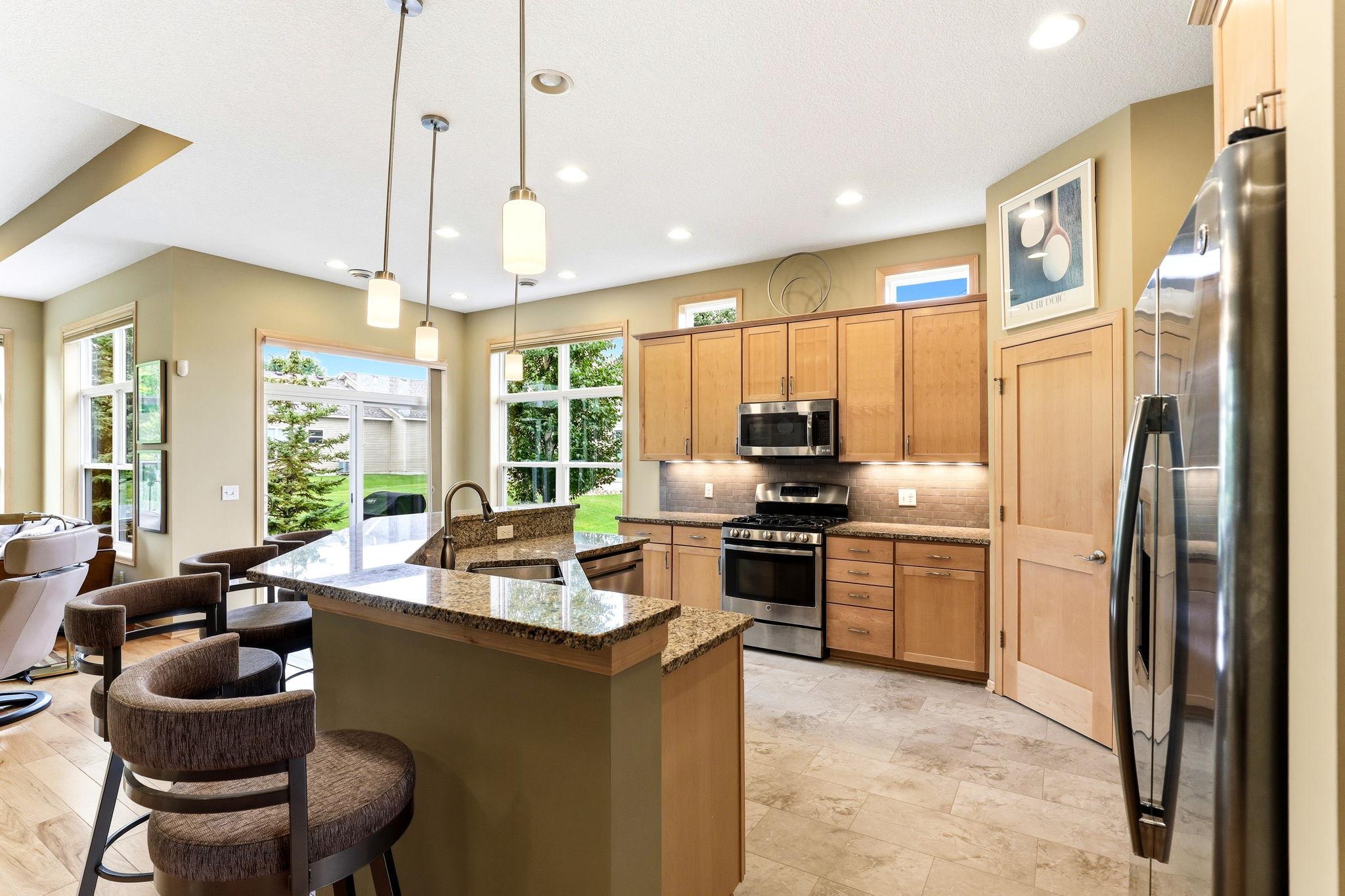 Stunning granite countertops create a sleek, high-end focal point in the kitchen. Bright, durable, and beautifully polished for a modern luxury finish.