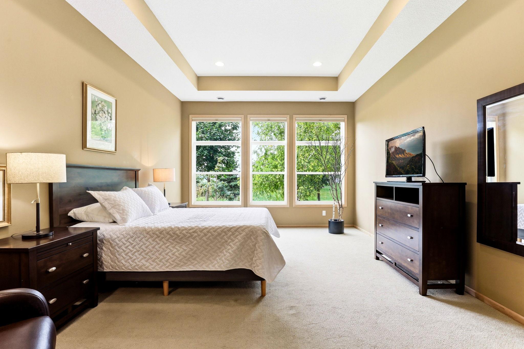 Expansive windows throughout the home fill each room with bright, natural light.