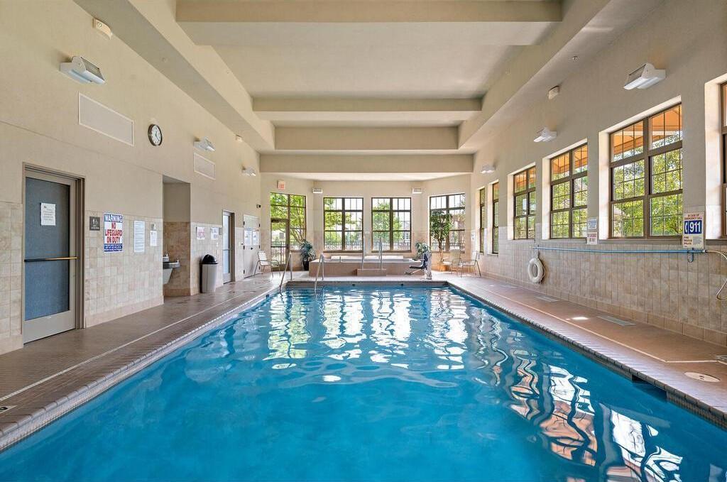 Indoor pool with relaxing hot tub, perfect for year-round enjoyment.