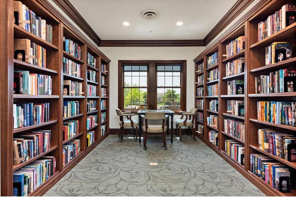 Elegant clubhouse library offering a quiet, refined space for reading.